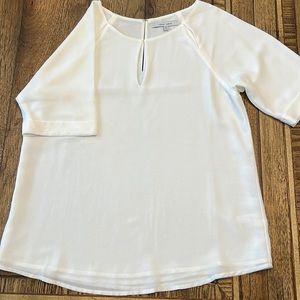 White blouse with 3 cutouts at neck